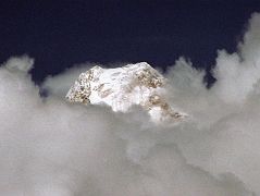 08 Gasherbrum IV Summit Pokes Out Of Clouds On Trek From Khoburtse To Goro II Up ahead, I kept my eye out for Gasherbrum IV, which poked its summit out of the clouds for a minute as I trekked from Khoburtse to Goro II.